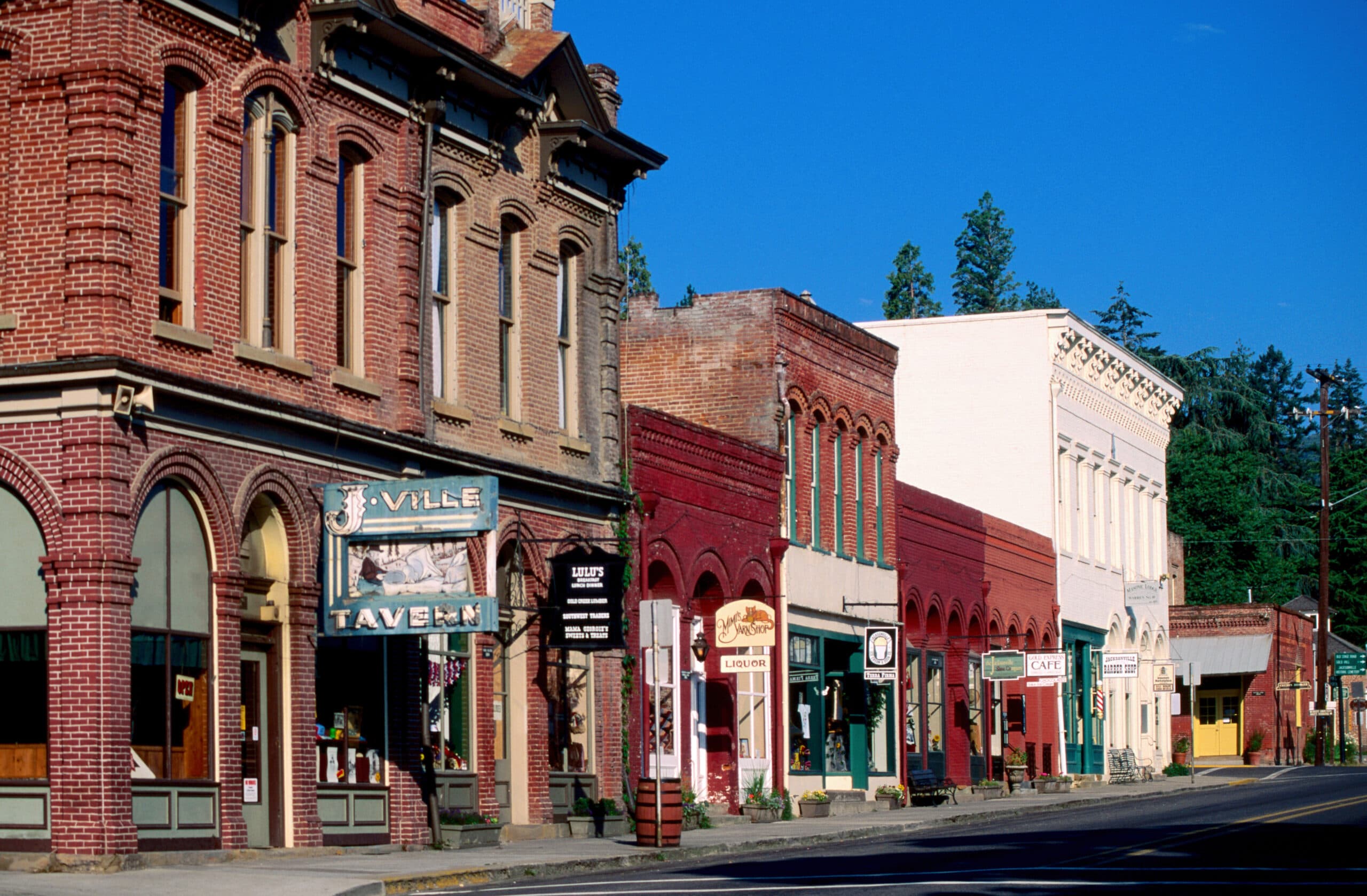 Historic California Street. The photo depicts several brick buildings with signs hanging in front.